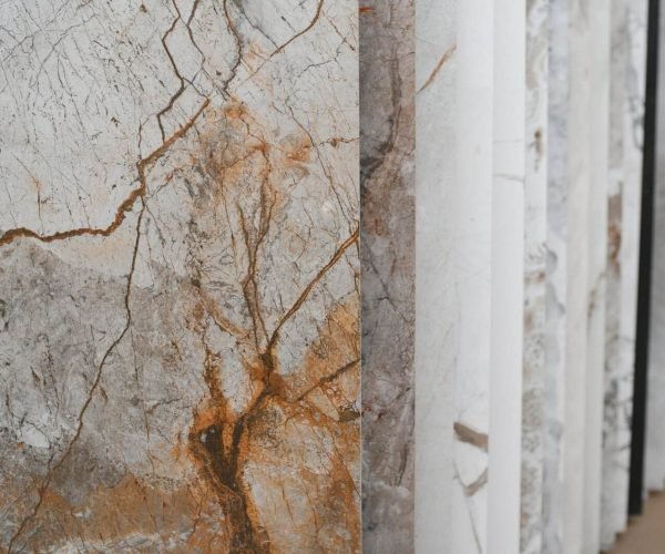 Variety of tile samples including marble and stone for flooring and walls.